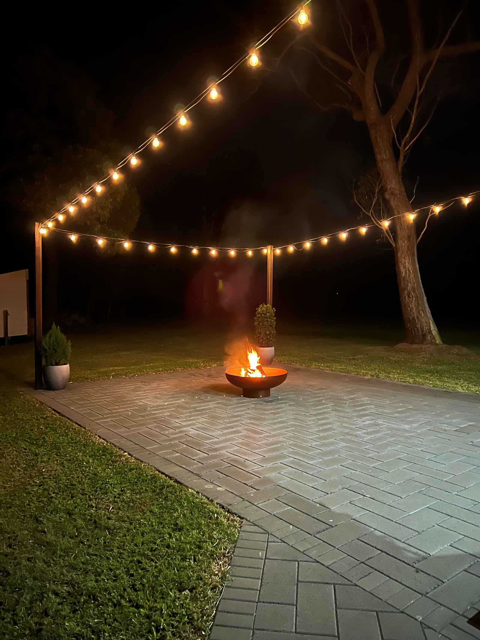Outdoor festoon lighting over residential entertaining area