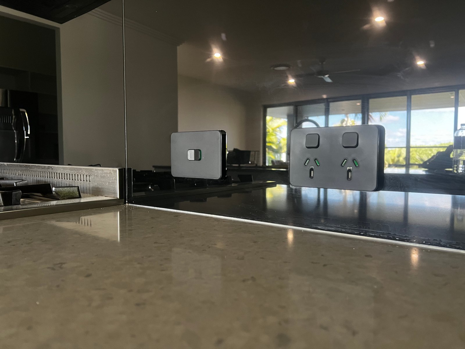 Black power point installation on kitchen splashback